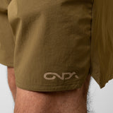Close-up of olive green shorts with an onda logo on a neutral background
