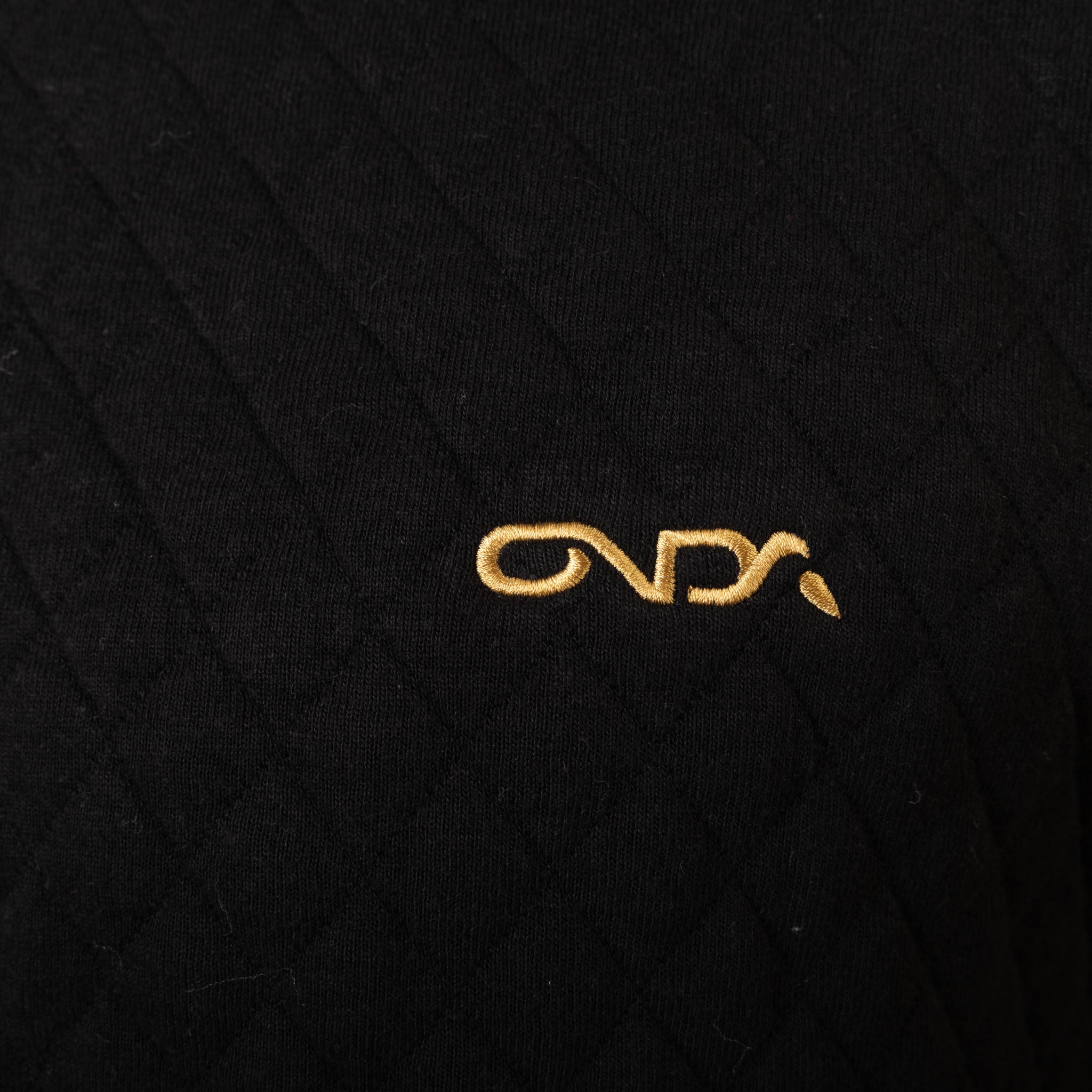 Gold onda logo on a black textured background